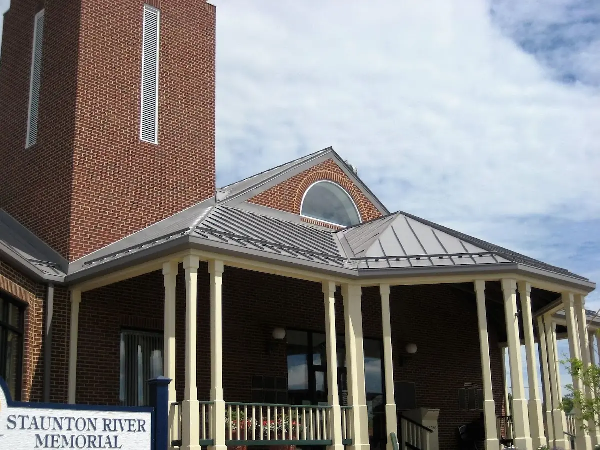 Skilled roofing craftsmen working on a residential roof in Altamont